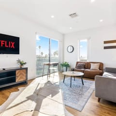 Light-filled K-Town Home- Parking + Gym- Near HWD